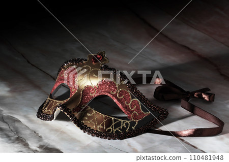Gold Carnival Mask on marble surface Gold Carnival Mask on marble surface 110481948