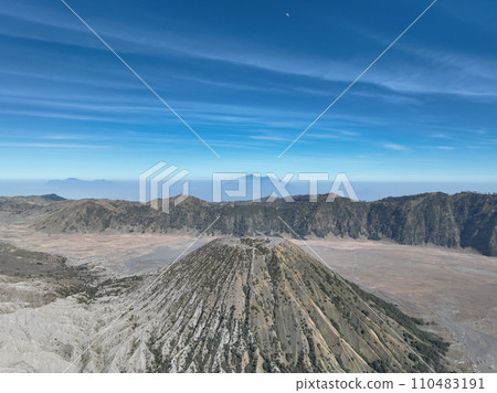 Aerial view Mountains at Bromo volcano during sunny sky,Beautiful Mountains Penanjakan in Bromo Tengger Semeru National Park,East Java,Indonesia.Nature landscape background Aerial view Mountains at Bromo volcano during sunny sky,Beautiful Mountains Penanjakan in Bromo Tengger Semeru National Park,East Java,Indonesia.Nature landscape background 110483191