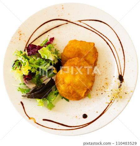There is plate - stuffed potatoes with meat and garnished with salad of fresh edible green. There is plate - stuffed potatoes with meat and garnished with salad of fresh edible green. 110483529