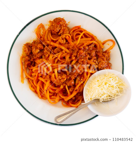 Delicious noodles Bolognese served in a plate on the table 110483542