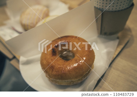 Donuts eaten at a cafe 110483729