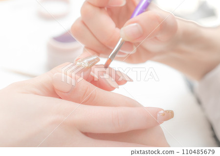 Nail salon_Applying top gel 6 Nail salon_Applying top gel 6 110485679