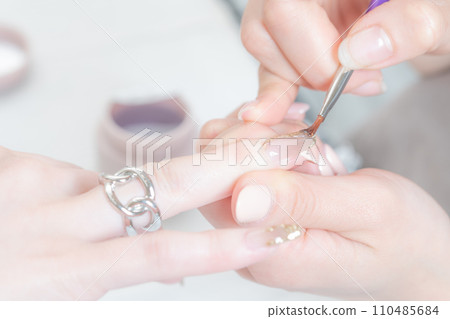 Nail salon_applying top gel 3 Nail salon_applying top gel 3 110485684