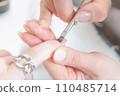 Nail salon_applying base gel 110485714