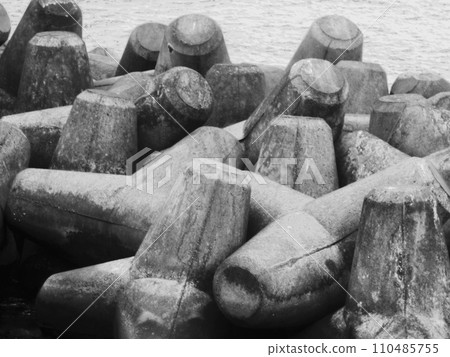 black stones on the sea shore black stones on the sea shore 110485755