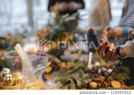 A yuletide feeling permeates the flower and Christmas decor store. 110485818