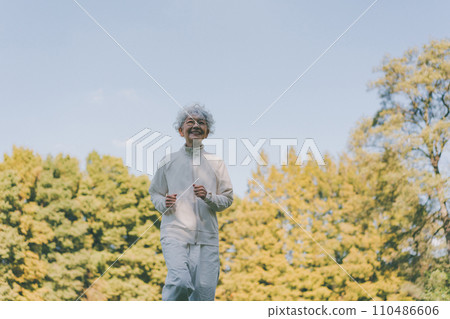 Senior woman slow jogging 110486606