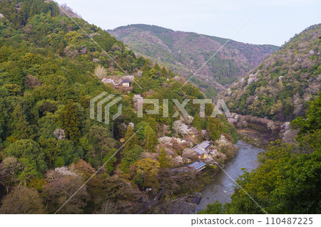 Early morning view of the Hozu River and Arashiyama in spring from the Arashiyama Park observation deck 110487225