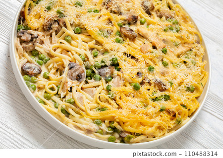 baked chicken tetrazzini in baking dish, top view baked chicken tetrazzini in baking dish, top view 110488314