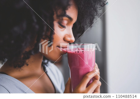 Close-Up of Woman with Berry Smoothie in Modern Scandi Apartment Close-Up of Woman with Berry Smoothie in Modern Scandi Apartment 110488514