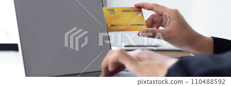 women use laptop to register online purchases using credit card payments, Convenience in the world of technology and the internet, Shopping online and banking online concept. 110488592