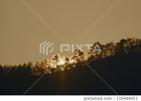 Mountain peaks at sunset in late autumn 110489051