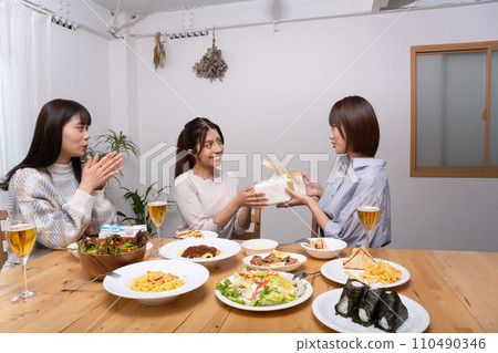 Young woman, girls' night out, three people, present 110490346