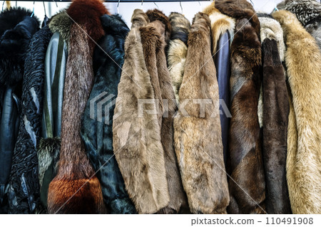 Fur coats on sale at a vintage store. Fashion and clothing. Fur coats on sale at a vintage store. Fashion and clothing. 110491908