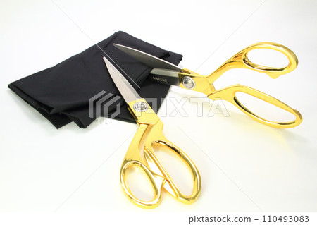 Fabric cutting scissors with golden grips 110493083