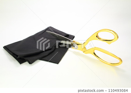 Fabric cutting scissors with golden grips 110493084