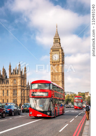 Big Ben with typical red buses on the bridge in London, England, UK Big Ben with typical red buses on the bridge in London, England, UK 110493140