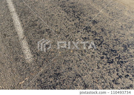 a part of an asphalt highway in close-up a part of an asphalt highway in close-up 110493734