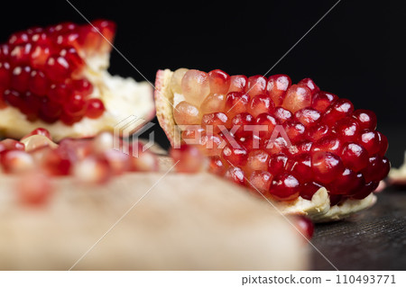 red ripe pomegranate with red grains 110493771