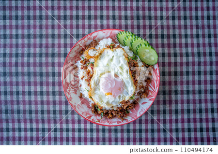 Minced pork and fried egg with basil Minced pork and fried egg with basil 110494174