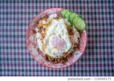 Minced pork and fried egg with basil Minced pork and fried egg with basil 110494175