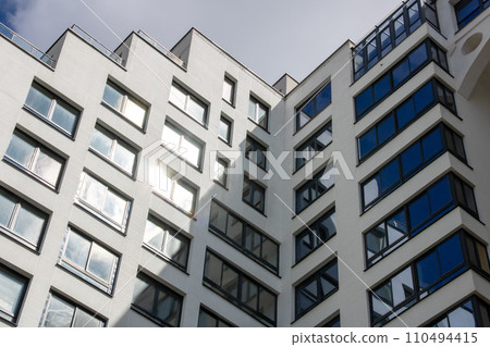 Background of glass windows of a tall building 110494415