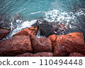 Mediterranean winter stormy seaside. Close up water with stones on the beach concept photo. 110494448
