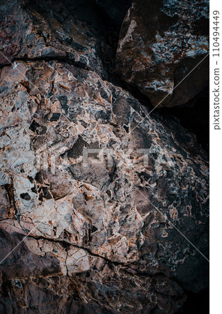 Light granite rock texture concept photo. Mountain rough surface. Close up stone background 110494449