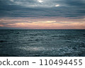 Winter Mediterranean sea waves landscape photo. Peaceful sunset time. Calm waves during vacation. 110494455