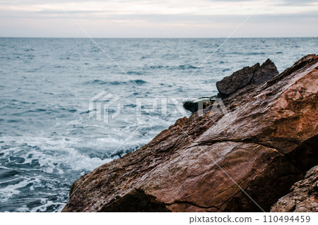 Winter sea with stones on the beach concept photo. Underwater rock. Mediterranean sea. 110494459