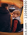Man and boy tourists autumn time leisure, vacation hiking or traveling touristic activity. Family camping, father and little son relax in forest camp. 110494690