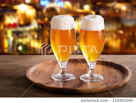 Cold glasses of beer in a bar Cold glasses of beer in a bar 110495094