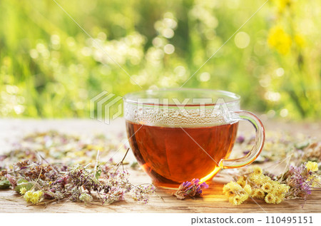 Cup of herbal tea with dried herbs Cup of herbal tea with dried herbs 110495151