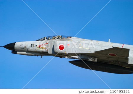 Air Self-Defense Force fighter aircraft F-4EJ Kai exhibiting flight display 110495331