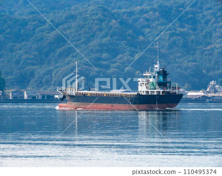 Cargo ship leaving the port 110495374