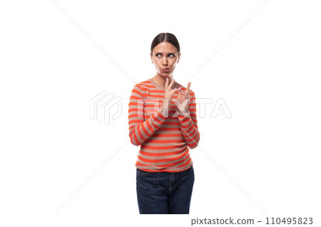 young european woman with black hair looks to the side attentively and suspiciously 110495823