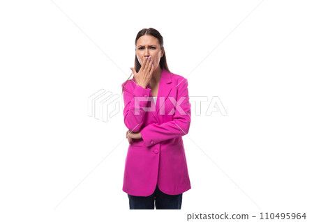 young pretty european woman with straight black hair is dressed in a pink jacket on a white young pretty european woman with straight black hair is dressed in a pink jacket on a white 110495964