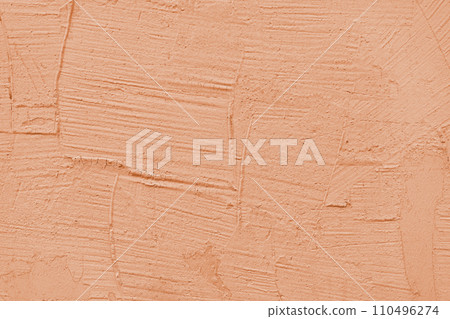 Stucco plaster surface background texture of orange painted cement, concrete wall 110496274