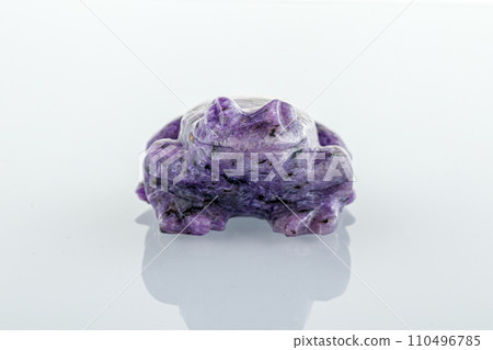 beautiful figurine of a toad from Charoite on a white background 110496785