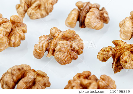 macro juglandaceae nuts, walnut on a white background macro juglandaceae nuts, walnut on a white background 110496829