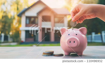 Piggy bank on house background. Piggy bank on house background. 110496932