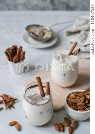 Horchata drink - traditional mexican rice based drink with cinnamon and almonds Horchata drink - traditional mexican rice based drink with cinnamon and almonds 110497528