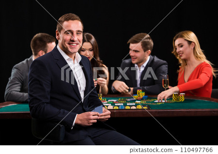 Young people playing poker at the table. Casino 110497766