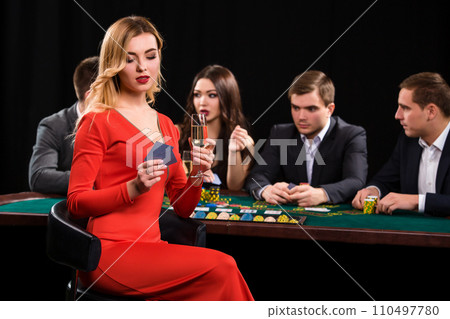 Young people playing poker at the table. Casino 110497780