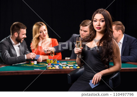 Young people playing poker at the table. Casino Young people playing poker at the table. Casino 110497796