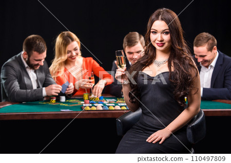 Young people playing poker at the table. Casino Young people playing poker at the table. Casino 110497809