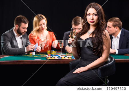 Young people playing poker at the table. Casino 110497820