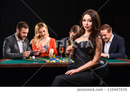 Young people playing poker at the table. Casino Young people playing poker at the table. Casino 110497830