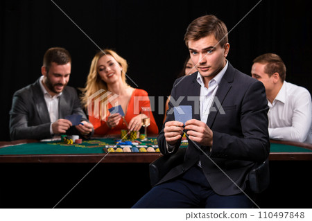 Young people playing poker at the table. Casino 110497848