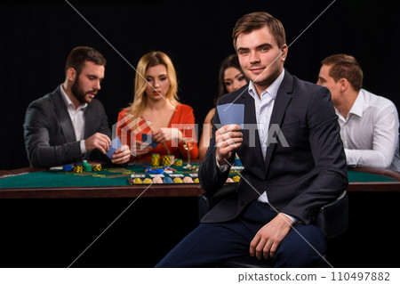 Young people playing poker at the table. Casino Young people playing poker at the table. Casino 110497882